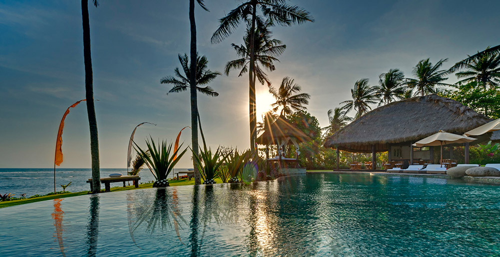 Taman Ahimsa - View across pool at sunset